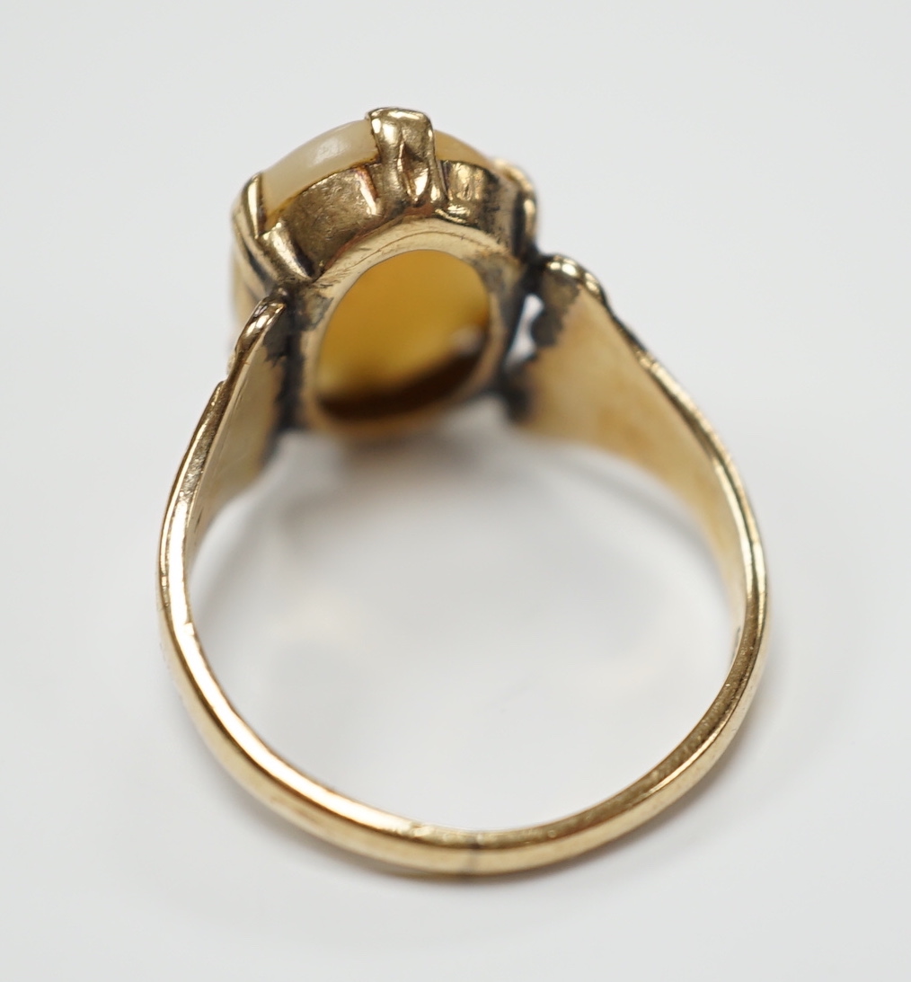 A 9ct gold and cameo shell set oval ring, size L, gross weight 2.8 grams.